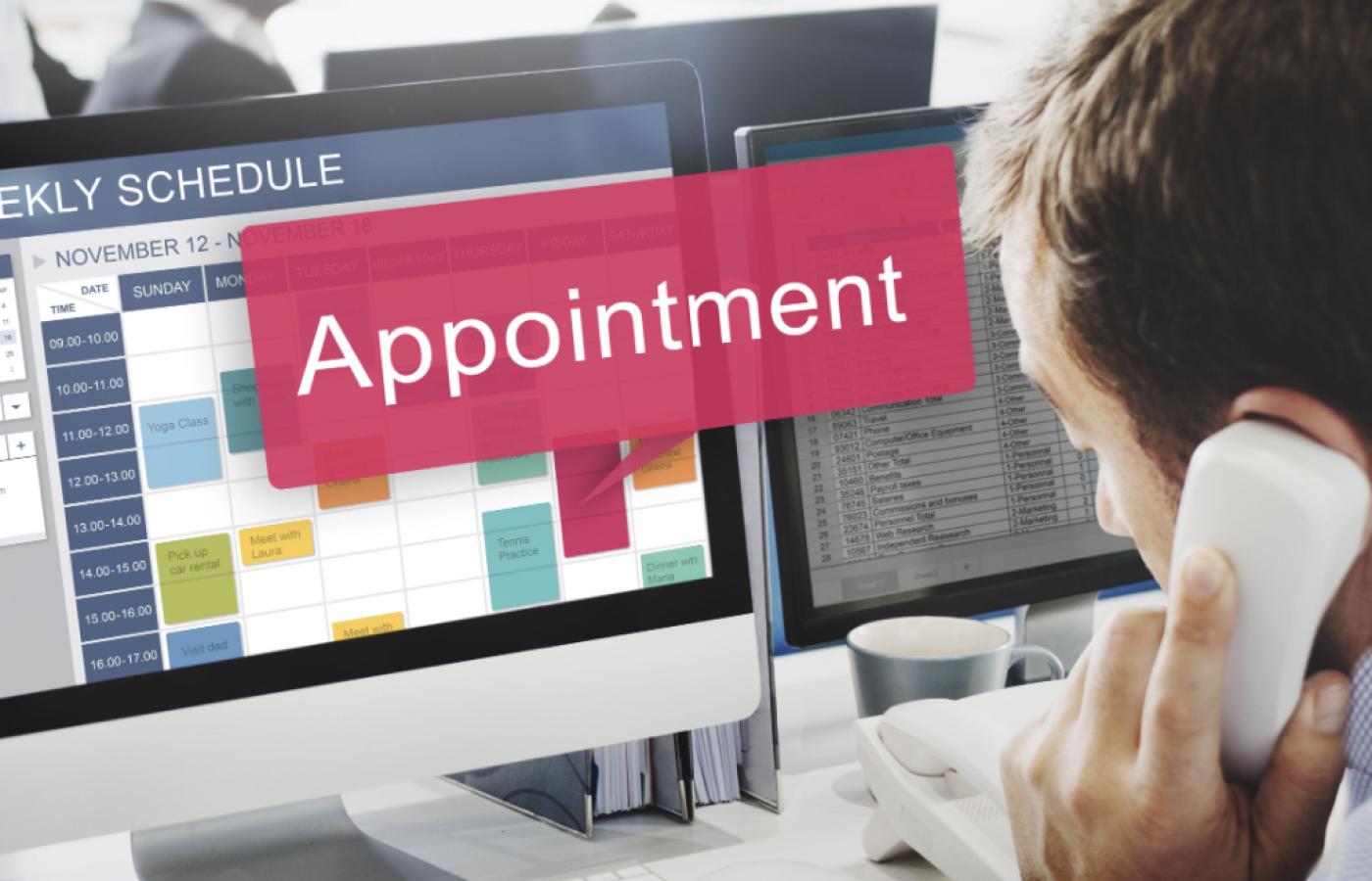 Person scheduling an appointment on a computer