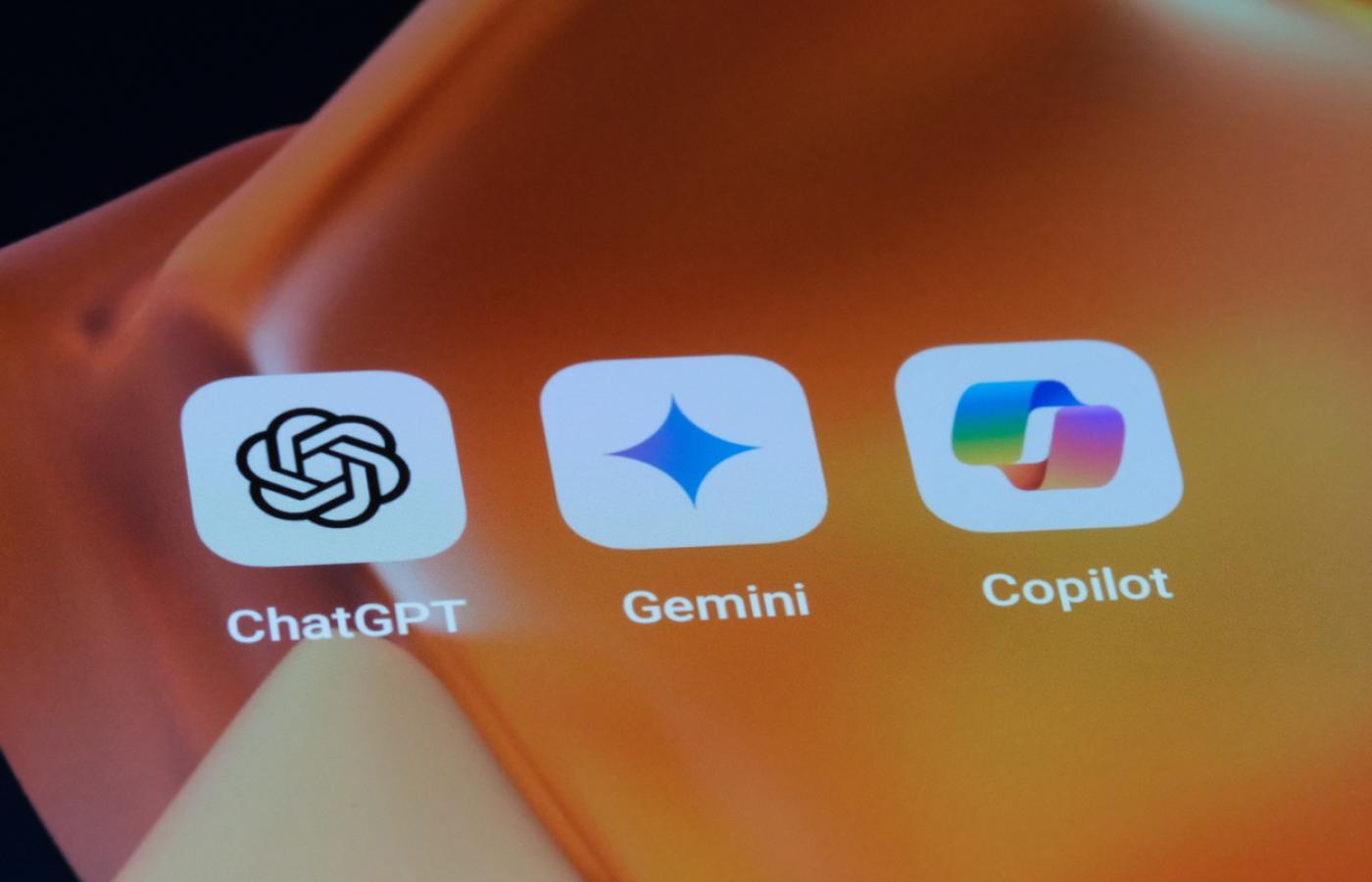 Logos for ChatGPT, Gemini, and Copilot