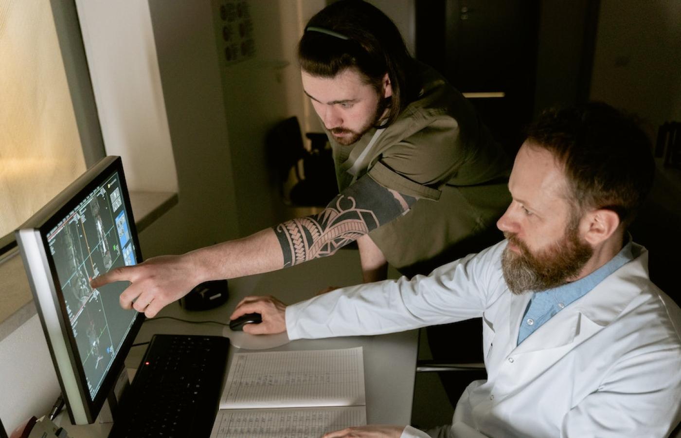 Scientists working on a computer